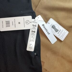 VOGO Athletica women’s yoga, exercise boot, cut pants, M. Side zip pockets.